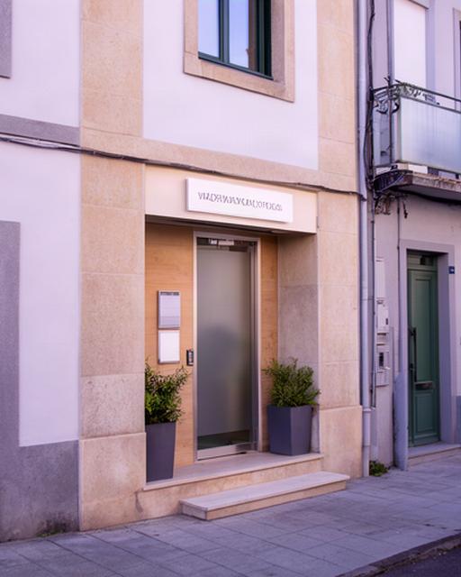 Fachada de una oficina jurídica en Villar, Piedras Blancas, con entrada a pie de calle